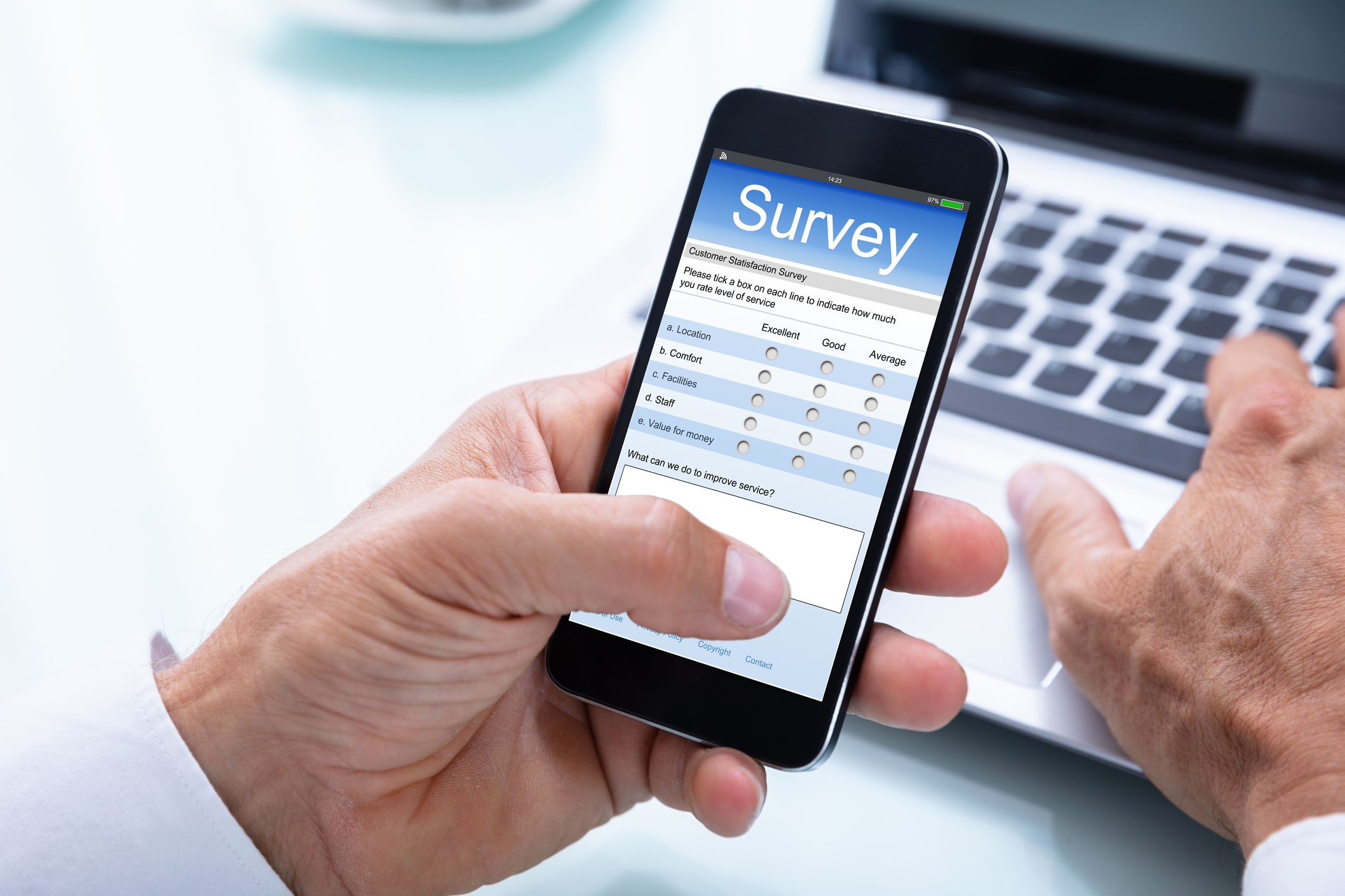 Businessman Filling Online Survey Form On Smartphone