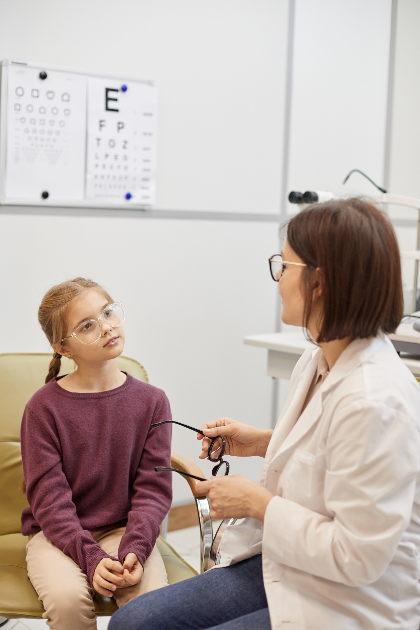 Little Girl Talking to Female Doctor