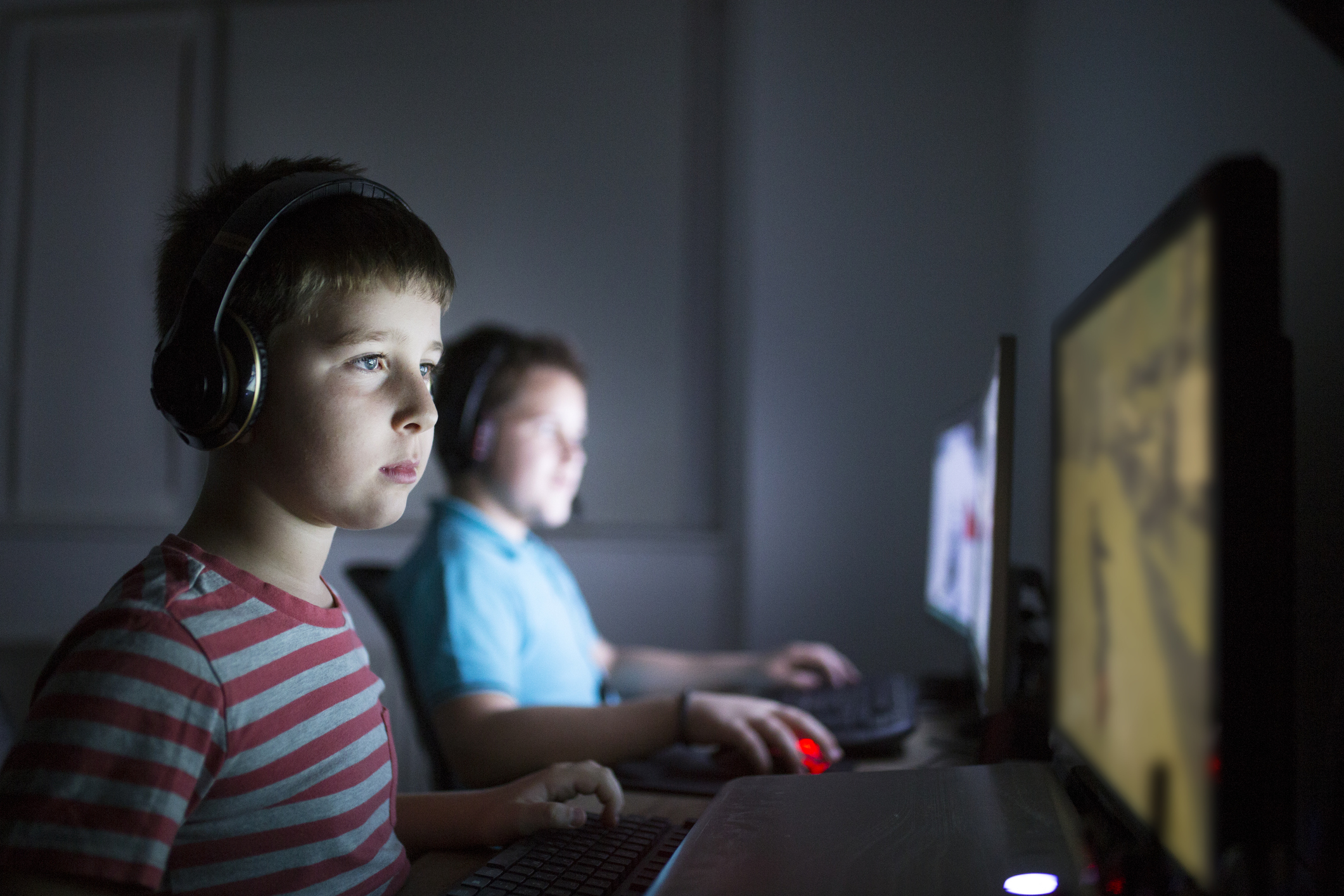 Two boys playing online games