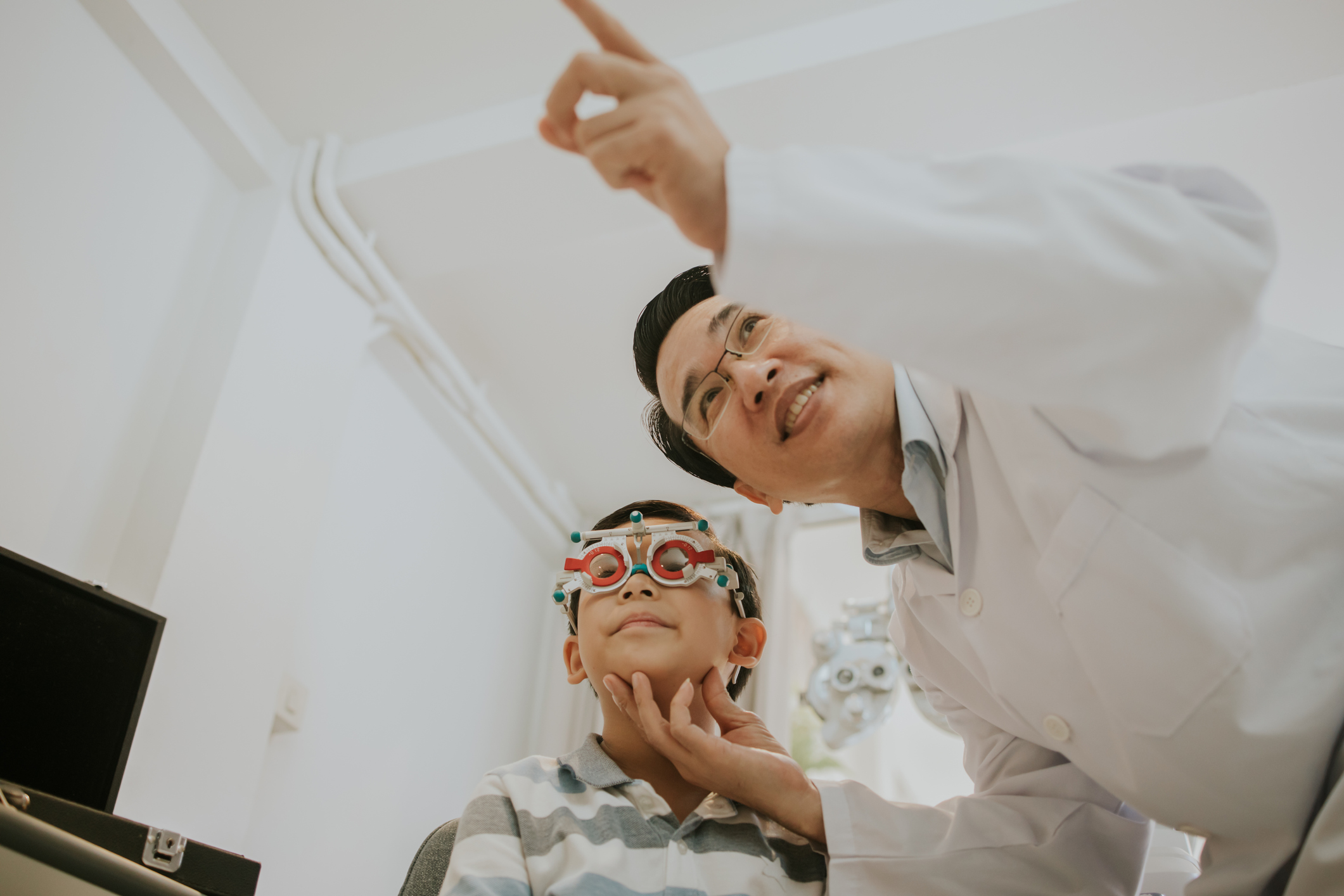 The ophthalmologist man with his patient boy-stock photo