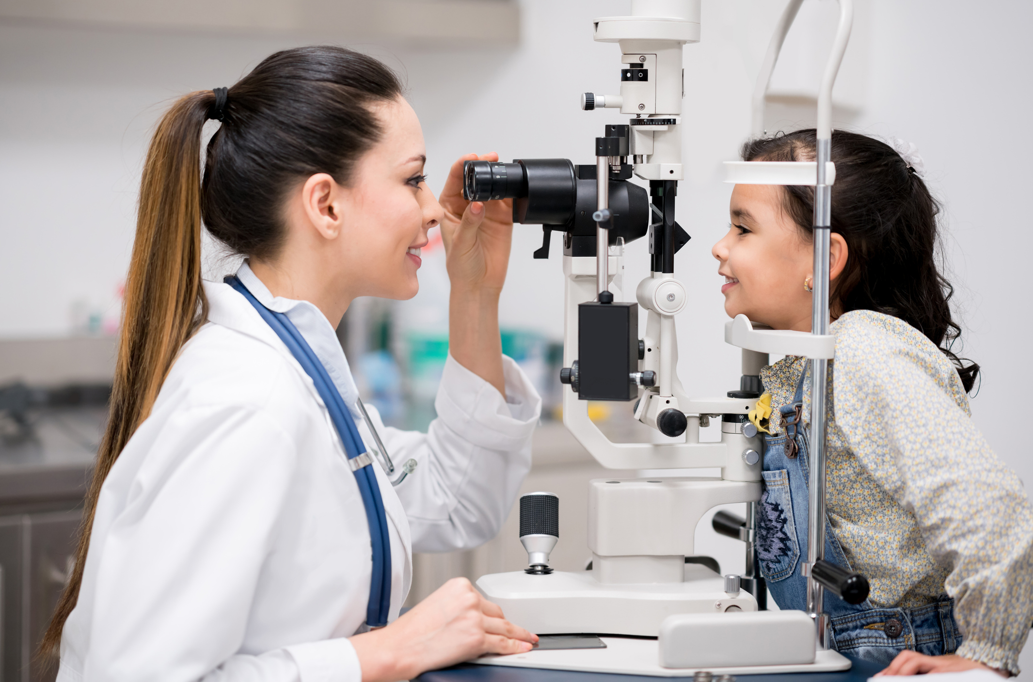 Girl getting an eye exam at the optician