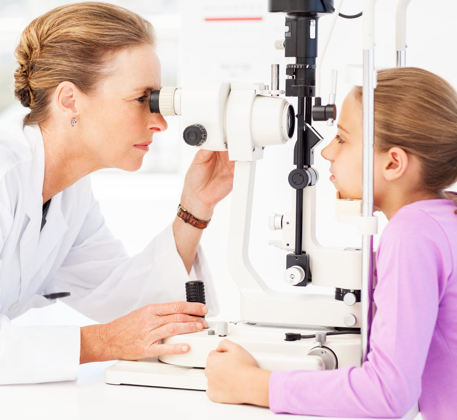 Optometrist Examining Girl’s Eyes With Slit Lamp