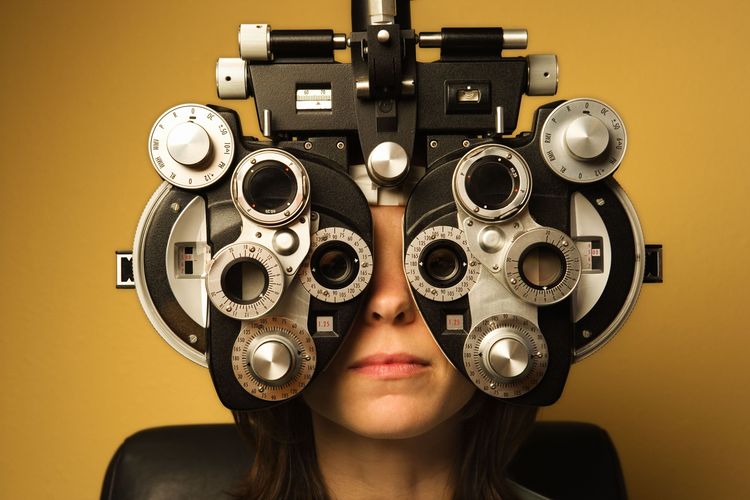 Woman getting eyes tested.