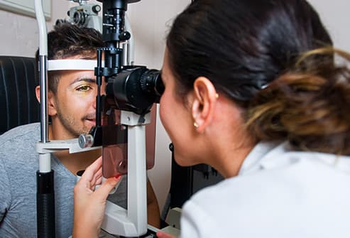 493ss_thinkstock_rf_doctor_looking_at_patients_eye