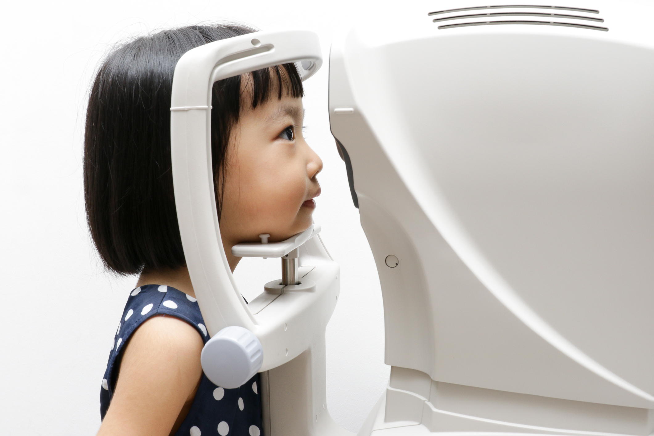 Asian Little Chinese Girl Doing Eyes Examination Through Auto re