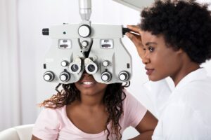 A photo of a child at the optometrist, indicating the need to check for accommodative lag