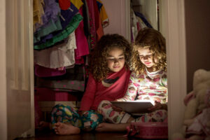 A photo of two young girls, indicating the need for progressive myopia treatment