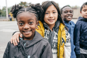 An image of a group of kids standing outside