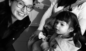 Dr. Damaris Raymondi with a young patient from her practice