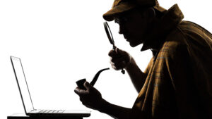 A detective looks at a laptop