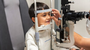 A young child gets an eye exam